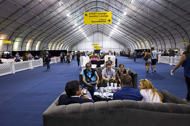 People network on couches during the Collision technology conference at the World Market Center Pavilions Wednesday, May 6, 2015.