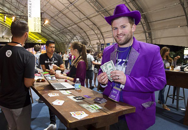 QWizard Jason Clark uses a blackjack game to draw attention to QZZR during the Collision technology conference at the World Market Center Pavilions Wednesday, May 6, 2015. QZZR software allows websites to create and embed quizzes that drive social traffic to the site, he said.
