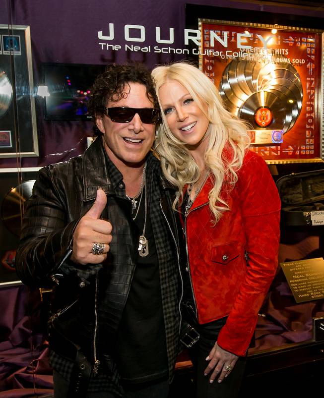 Neal Schon and Journey memorabilia cases are unveiled Wednesday, May 6, 2015, at the Hard Rock Hotel. Schon is pictured here with wife Michaele.