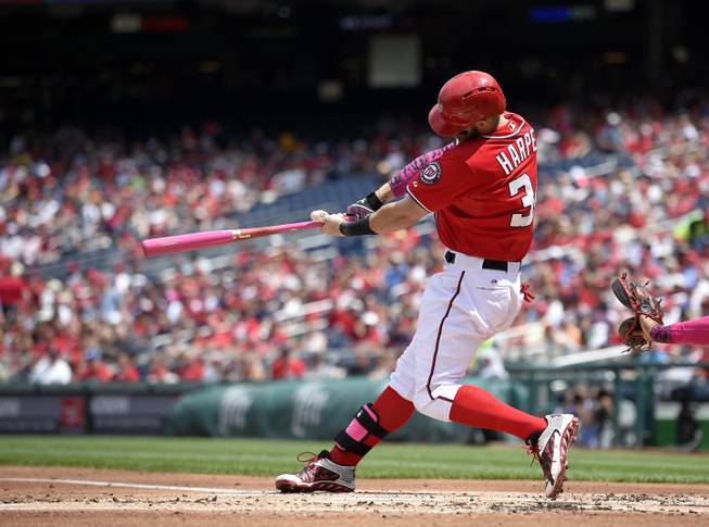 Washington Nationals' Bryce Harper hits a double against the Atlanta Braves during the first inning of a baseball game Sunday, May 10, 2015, in Washington, D.C. 