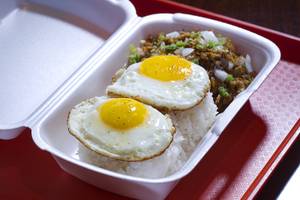 Pork Sisig Rice Bowl with Fried Eggs at theWhite Rabbit Cafe, 3429 S Jones Blvd., Sunday, May 10, 2015. The business started as a Filipino-fusion food truck in Southern California.