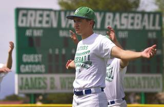Matt Uran warms up with members of the Green Valley High School baseball team during practice at the school in Henderson Monday, May 11, 2015. On Thursday, the team begins play in the four-team Division I state tournament, looking for the program's first state championship since 2003. 
