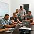 Entrepreneurs work together in a conference room at The Mill on May 12, 2015.