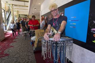 Magician Murray Sawchuck waits to pay for chandeliers from the Frank Sinatra Suite during the first day of a liquidation sale Thursday, May 14, 2015, at the Riviera. Sawchuck performs at Planet Hollywood.
