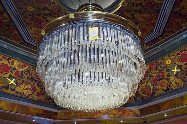 A chandelier ($3,500.00) is shown over the casino floor during the first day of a liquidation sale at the Riviera Thursday, May 14, 2015.