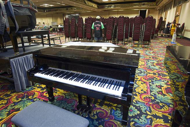 A piano ($5,500.00) is displayed during the first day of a liquidation sale at the Riviera Thursday, May 14, 2015.