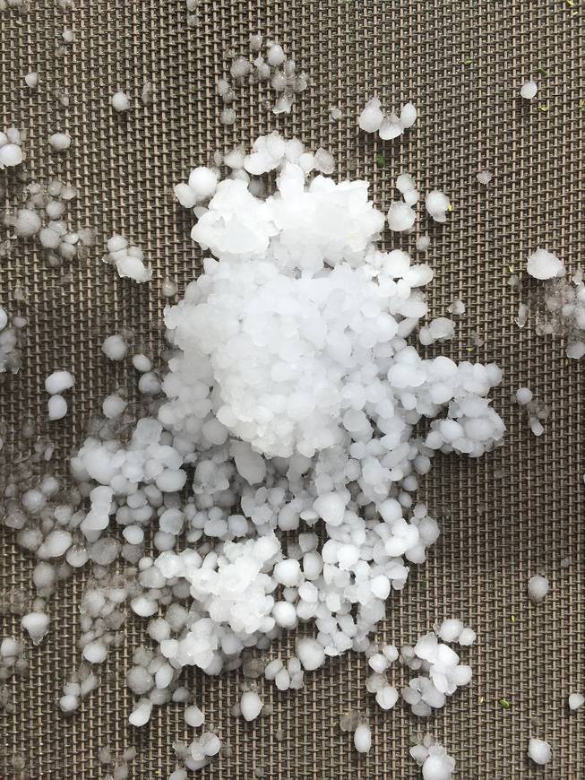 Hail can be seen on outdoor furniture in a North Las Vegas neighborhood, Thursday, May 14, 2015.