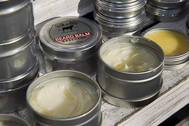 Cans of beard balm are displayed at the Tusk & Hide booth in a vendor area of the Punk Rock Bowling & Music Festival in downtown Las Vegas Monday, May 25, 2015.