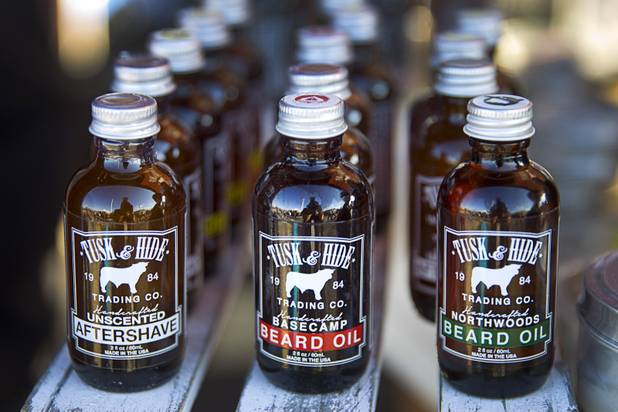 Bottles of aftershave and beard oils are displayed at the Tusk & Hide booth in a vendor area of the Punk Rock Bowling & Music Festival in downtown Las Vegas Monday, May 25, 2015.