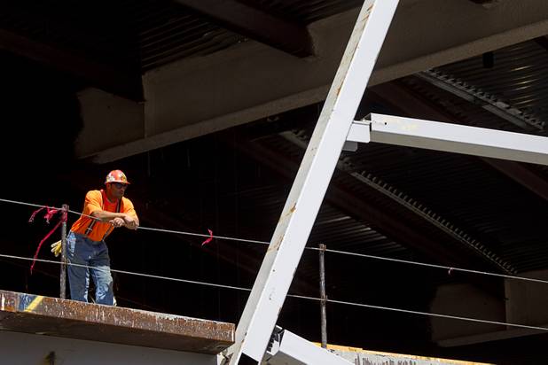 A worker looks out from the Las Vegas Arena before a topping off ceremony Wednesday, May 27, 2015. Representatives from MGM Resorts International and AEG, contractors Hunt-Penta and elected officials were on hand to celebrate the installation of the arena's final steel beam. The $375 million arena is scheduled to open in Spring 2016.