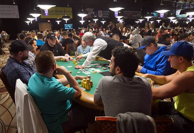 Las Vegas Sun reporter Case Keefer, second right, competes in the $565 buy-in "Colossus" event during the World Series of Poker at the Rio Monday, June 1, 2015.