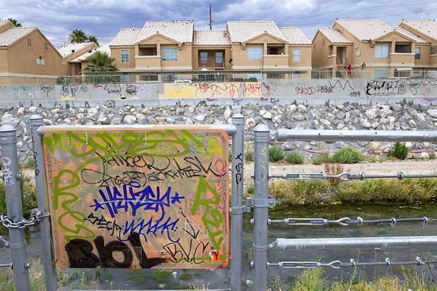 Graffiti is shown along the Las Vegas Wash channel near Pecos Road and Lake Mead Boulevard Tuesday, June 9, 2015.