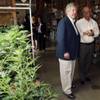In this photo taken Saturday, April 25, 2015, Nevada Sen. Tick Segerblom and Ronald Dreher, government affairs director for Peace Officers Research Association of Nevada, pass by an area with marijuana plants under cultivation as Nevada lawmakers, their staffers and lobbyists toured two retail and grow operations for medical and recreational marijuana in northeast Denver. 