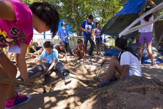 Students prepare a planting area during a summer garden camp at Crestwood Elementary School Tuesday, June 16, 2015. Green Our Planet, a Las Vegas nonprofit organization established in 2013, has helped establish gardens in dozens of area schools.