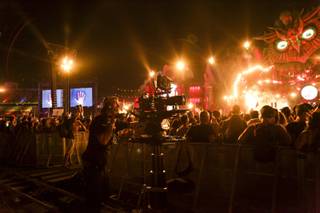 A camera man films the crowd during the Above & Beyond set at the Kinetic Field stage during the 2015 Electric Daisy Carnival at the Las Vegas Motor Speedway Saturday, June 20, 2015.