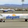 In this Thursday, May 9, 2013, file photo, two Allegiant Air jets taxi at McCarran International Airport in Las Vegas.