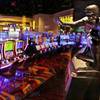 The Heisman Trophy won in 1984 by Boston College quarterback Doug Flutie is displayed at Plainridge Park Casino in Plainville, Mass., Tuesday, June 23, 2015. The casino, a slot machine parlor, opened Wednesday, June, 24, 2015. The Plainridge Park Casino represents the first gambling destination to open since state lawmakers approved a casino law in 2011.