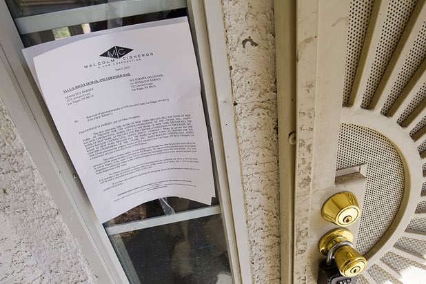 A foreclose notice is posted on a home in a neighborhood near Tenaya Way and Russell Road Thursday, June 25, 2015.