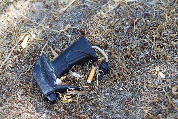 Garbage is shown in the front yard of a foreclosed home is shown in a neighborhood near Tenaya Way and Russell Road Thursday, June 25, 2015.