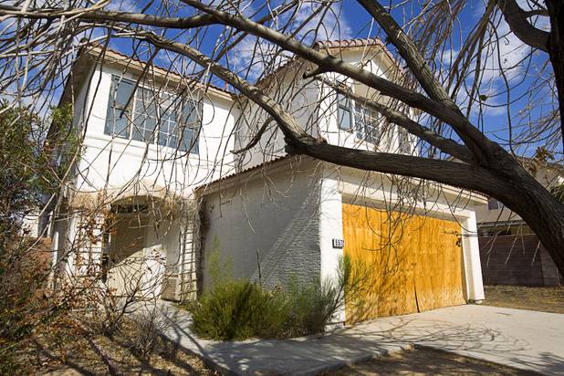A foreclosed home on Airview Court, in a neighborhood near Tenaya Way and Russell Road, is shown Thursday, June 25, 2015.