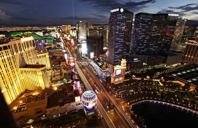 In this Sept. 16, 2014, photo taken with a slow-shutter speed, lights of cars blur along Las Vegas Boulevard. 