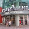 In this June 26, 2015, photo, customers leave the Playground, developer Bart Blatstein's $52 million remake of the former Pier Shops complex, in Atlantic City, N.J. Atlantic City's efforts to recapture some of the tourism dollars it has lost to casino competition in recent years finally appear to be working.