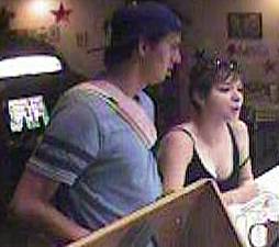 This woman allegedly stole personal belongings of a male victim at a gaming business in Las Vegas on July 6, 2015. The man at left is believed to be her accomplice.