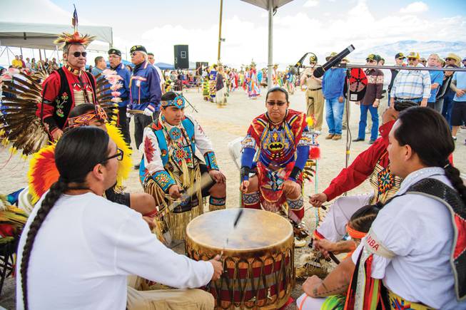 Tribe members sing and play drums during an annual powwow at Snow Mountain Reservation.