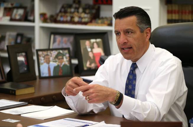 Gov. Brian Sandoval sits in his office at the Capitol on Friday, April 17, 2015, in Carson City.