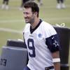 Dallas Cowboys quarterback Tony Romo smiles as he walks off the field during an NFL-organized team activity Wednesday, July 21, 2015, in Irving, Texas.