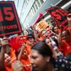 Activists calling for a higher minimum wage for fast-food workers gather to hear a state panel’s decision on the matter, in New York, July 22, 2015. The panel recommended that the minimum wage for fast-food workers be set at $15. 
