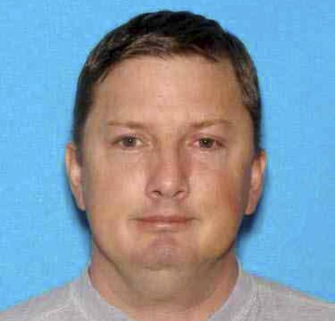 This undated Oregon driver identification photo released Monday, July 27, 2015, by the Charleston, W. Va., Police Department shows Neal Falls, of Springfield, Ore., killed by a women he attacked on July 18 in Charleston. Police are investigating whether Falls had any connection to cases of suspicious deaths and missing women in other states, including Nevada.