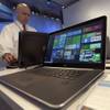 In this April 29, 2015 file photo, a Dell laptop computer running Windows 10 is on display at the Microsoft Build conference in San Francisco. 