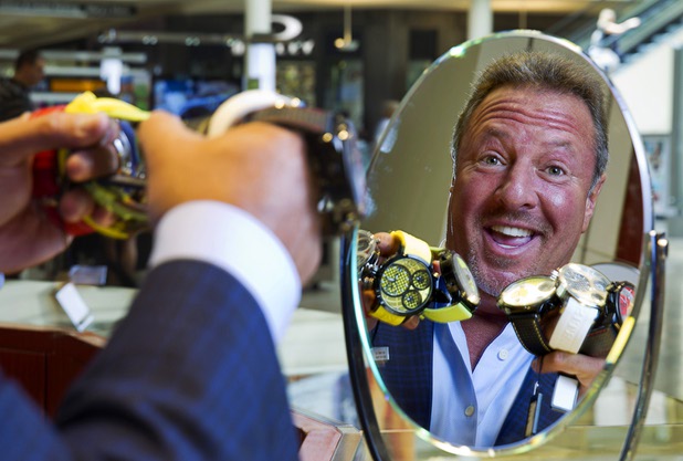Stuart Berger, owner of Berger & Son Fine Jewelers, is reflected in a mirror in the store at the Fashion Show Mall Monday Aug. 3, 2015.