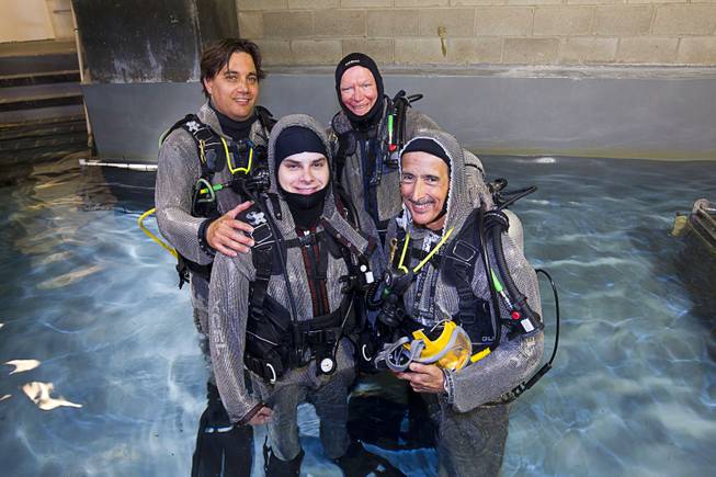 Diver pose before a maintenance dive in Shark Reef at Mandalay Bay Tuesday, Aug. 4, 2015. From left, Ryan Acevedo, Grayson Caldwell, Richard Kanthack and Jack Jewell, general curator of Shark Reef.