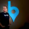 Banjo CEO Damien Patton stands Thursday, Aug. 6, 2015, in the company’s event center.