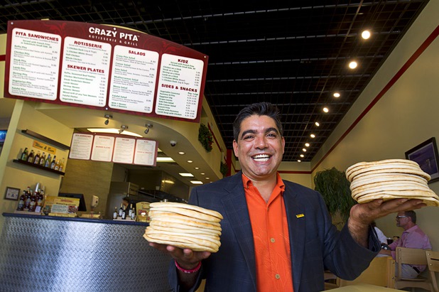 Mehdi Zarhloul, president and CEO of Crazy Pita Rotisserie & Grill, poses at the original Crazy Pita at the The District in Henderson Wednesday, Aug. 12, 2015. Zarhloul also has locations at Town Square and Downtown Summerlin. 