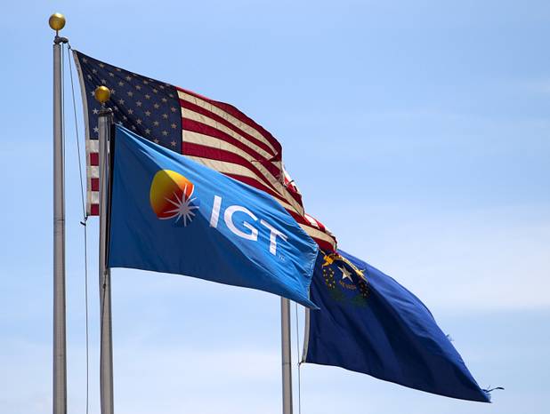 Flags fly at International Game Technology (IGT) headquarters at 6355 S Buffalo Dr. Thursday, Aug. 13, 2015.