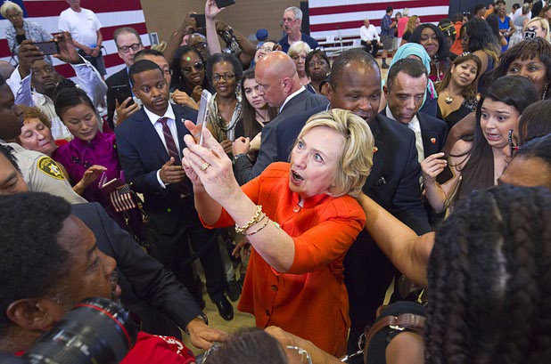 Democratic presidential candidate and former Secretary of State Hillary Rodham Clinton takes a selfie with a supporter's phone after speaking at a town hall meeting at the Pearson Community Center in North Las Vegas Tuesday, Aug. 18, 2015.