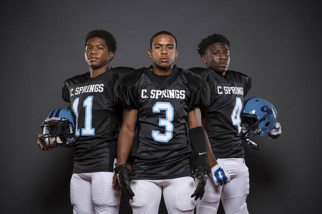 Canyon Springs football players Tyson Odum, Tre'von Dean, and Marcell Selmon before the 2015 Season.