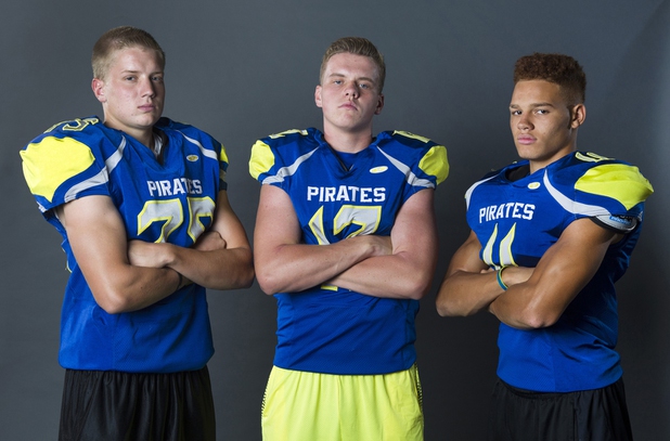 Moapa Valley Pirates, from left, Dennis Whitmore (75), Nate Cox (12) and RJ Hubert (11) during Las Vegas Sun's High School Football media day, Monday, July 27, 2015. 