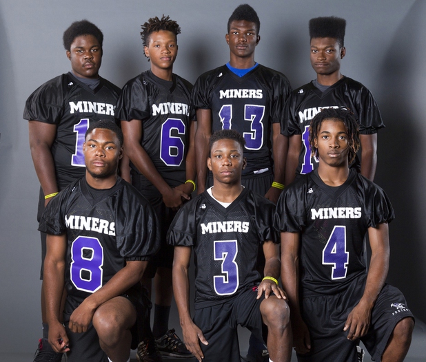 Sunrise Mountain Miners pose during the Las Vegas Sun's High School Football media day (make up) Monday, July 27, 2015. From left, front row: Dalwin Spates (8), Rayshawn Johnson (3) and Claude Moore III. Back row: Ja'twion Farmer (16), Stephen Wright Jr. (6), Travis Carpenter (13) and Solomon King (14).  STEVE MARCUS