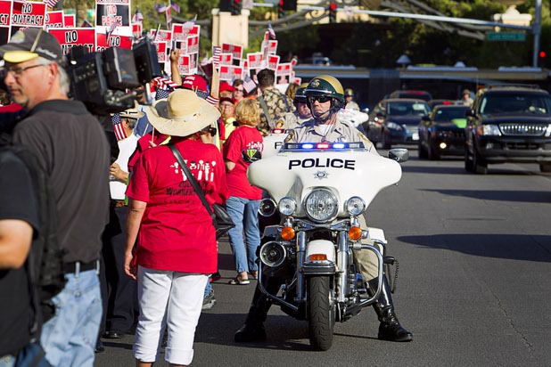 Metro Police motorcycle officers keep protestors separated from traffic as members of the Culinary Workers Union, Local 226, protest near the Trump International Hotel Las Vegas Friday, Aug. 21, 2015. The Trump International Hotel workers are not unionized. STEVE MARCUS