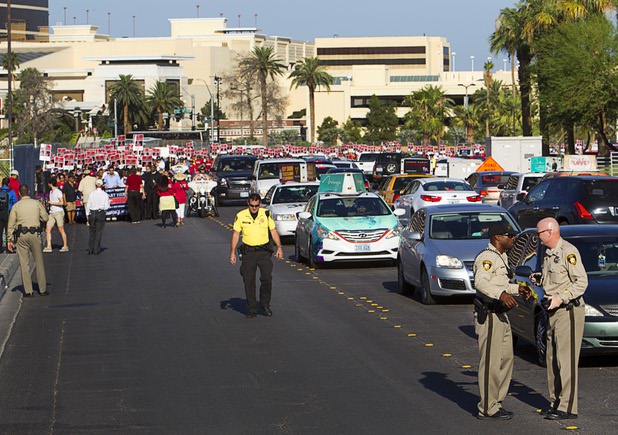 Members of the Culinary Workers Union, Local 226, and supporters march toward the Trump International Hotel Las Vegas during a protest Friday Aug. 21, 2015. The Trump International Hotel workers are not unionized. STEVE MARCUS