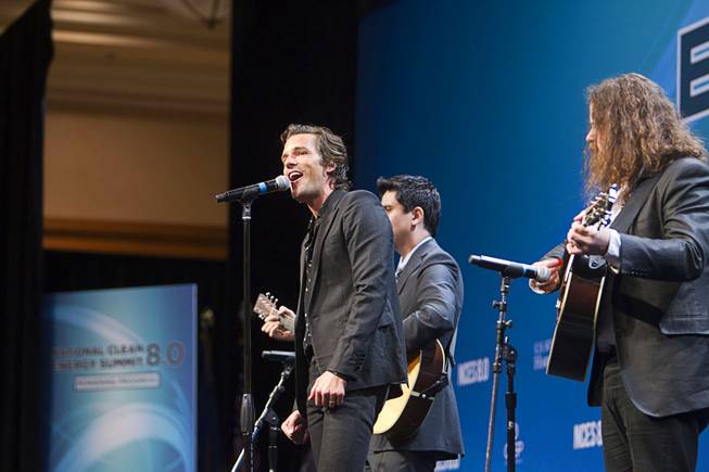 Brandon Flowers, left, of the "Killers" sings "Home Means Nevada" before President Barack Obama's keynote address during the National Clean Energy Summit 8.0 at the Mandalay Bay Convention Center Monday, Aug. 24, 2015.