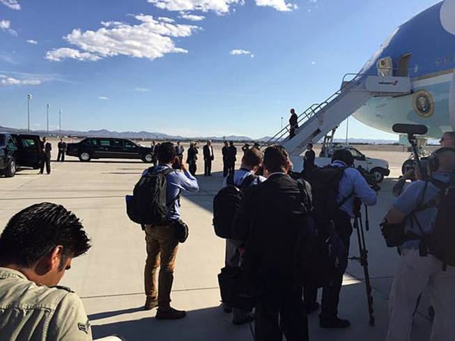 President Barack Obama deplanes Air Force One after arriving at McCarran International Airport Monday, Aug. 24, 2015.