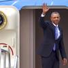 President Barack Obama waves as he boards Air Force One for departure from McCarran International Airport Tuesday, Aug. 25, 2015. Obama visited Las Vegas to present a keynote address at the National Clean Energy Summit and attend a fundraiser. 