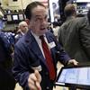 Trader Tommy Kalikas works on the floor of the New York Stock Exchange, Wednesday, Aug. 26, 2015. U.S. stocks are opening sharply higher Wednesday after slumping for six straight days amid concern that growth in China was slowing more quickly than previously thought.