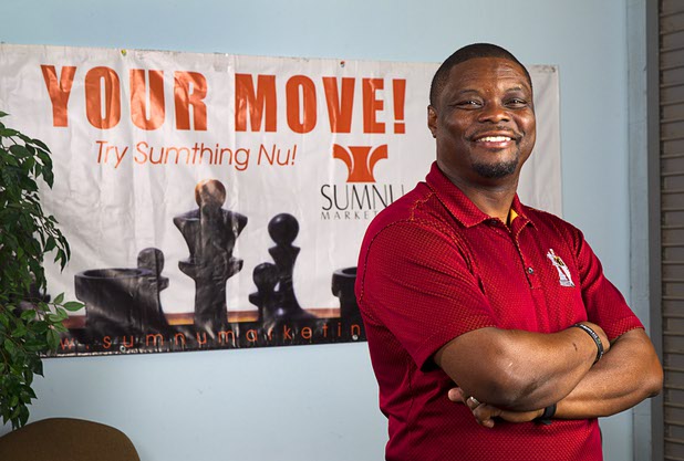 Shaundell Newsome, founder of Sumnu Marketing, poses at the company offices Thursday, Sept. 3, 2015. 