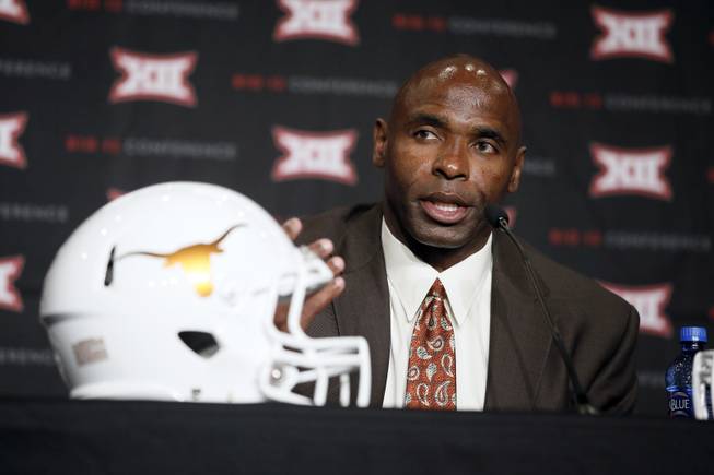 Texas head football coach Charlie Strong responds to questions during the Big 12 Conference Football Media Days Tuesday, July 21, 2015, in Dallas.